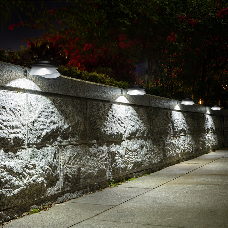 Warm white LED solar wall lights illuminating yard